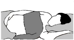 an illustration of the proper draping technique for side lying prentatal massage.